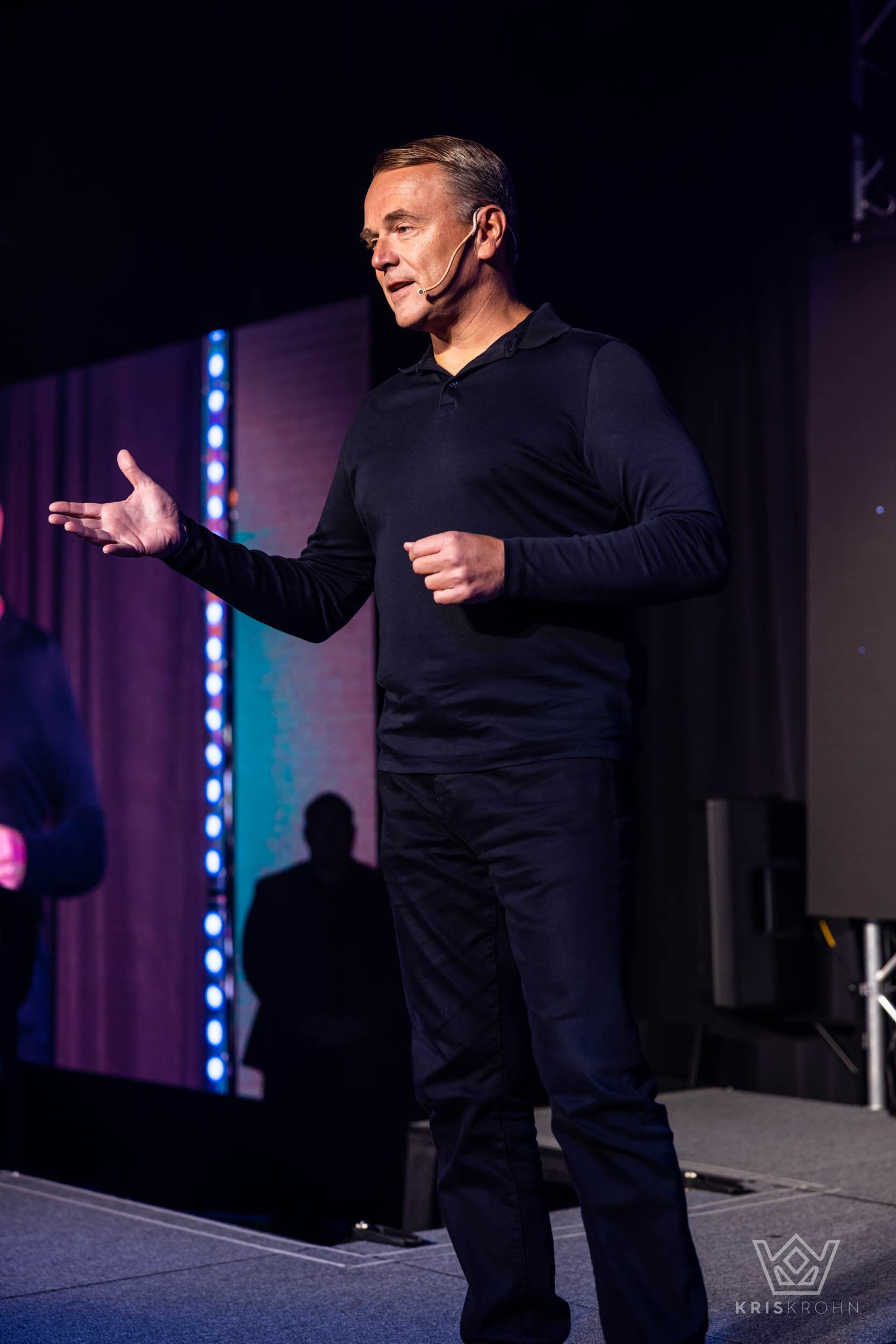 Sean Callagy speaking onstage